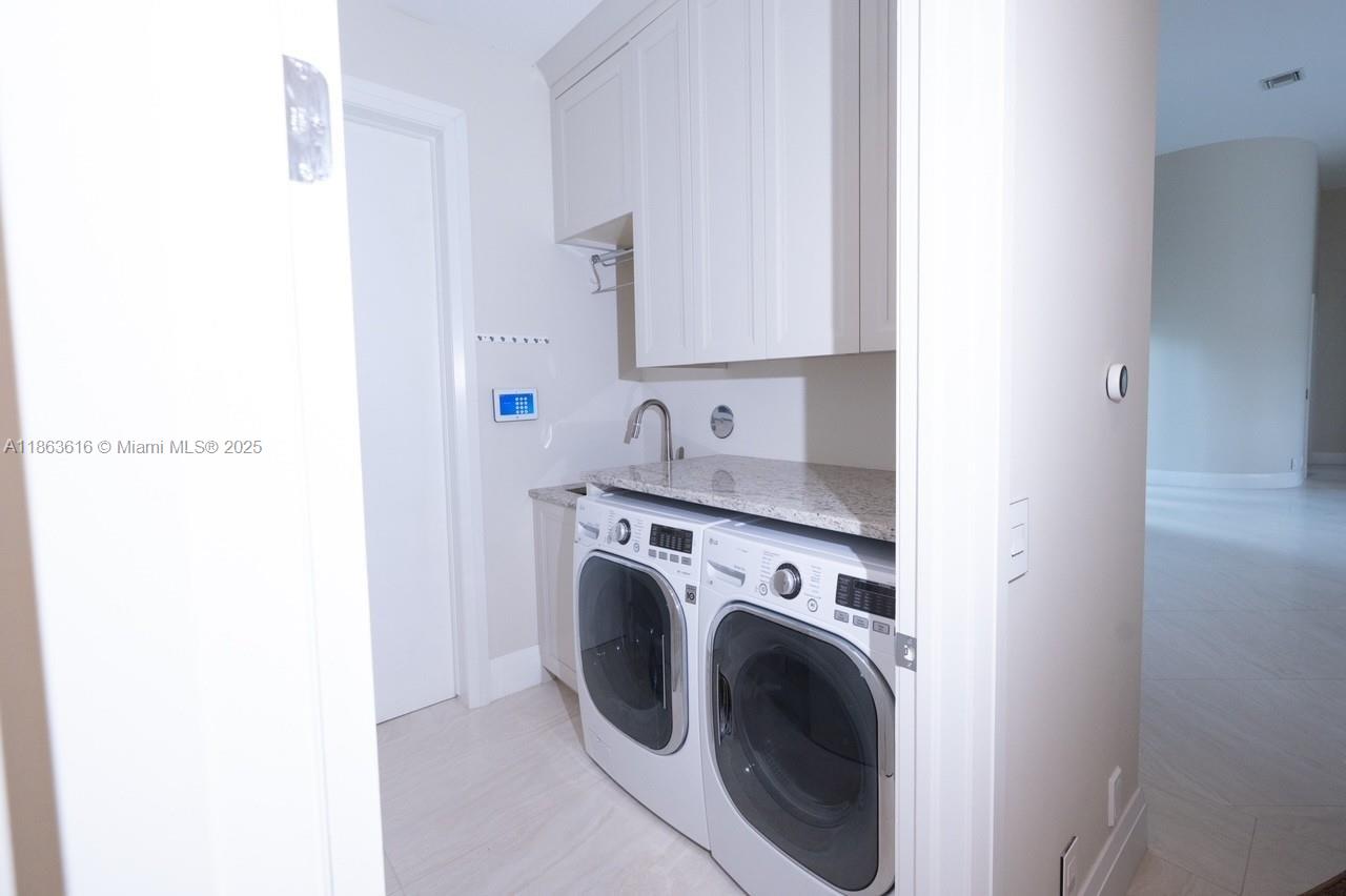 17969 Fairoaks Way Boca Raton, FL 33498 - Photo 17 of 24 a view of a kitchen with sink washer and dryer