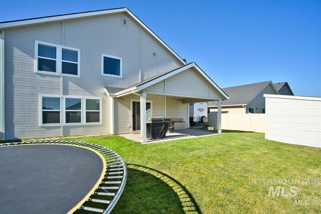 12656 Brun Street Caldwell, ID 83607 - Photo 29 of 39 Rear view of house with a patio area