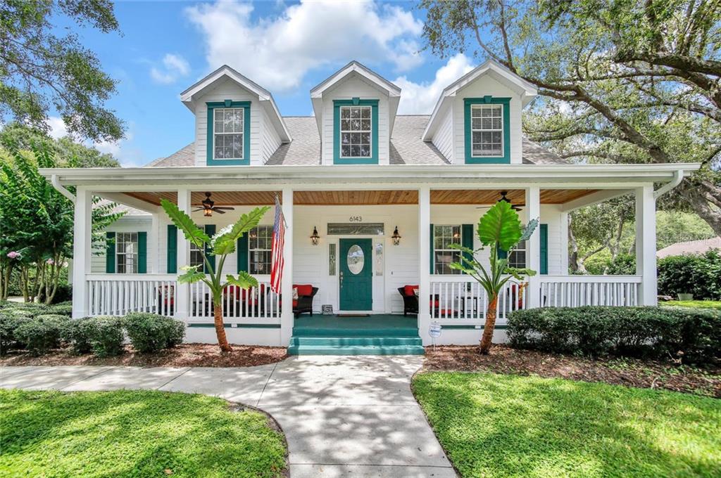 6143 Riviera Lane New Port Richey, FL 34655 - Photo 1 of 1 a front view of house with yard and green space