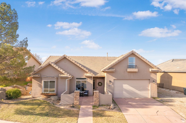 1570 South Rio Virgin Drive Washington, UT 84780 - Photo 2 of 71 View of front of home featuring driveway, stucco siding, a garage, and a tile roof
