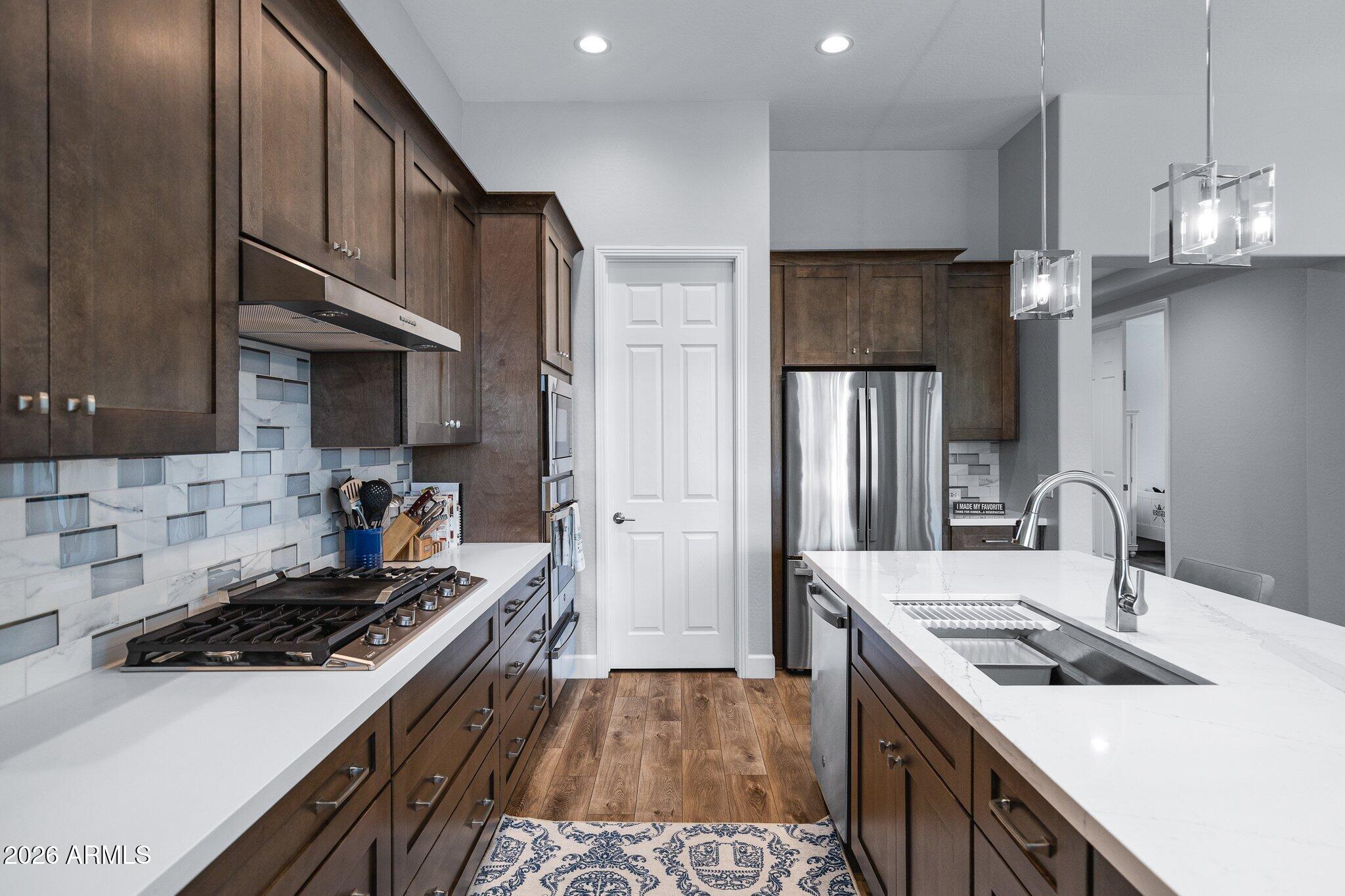 16897 West Almeria Road Goodyear, AZ 85395 - Photo 12 of 51 Spacious Chef-Inspired Kitchen