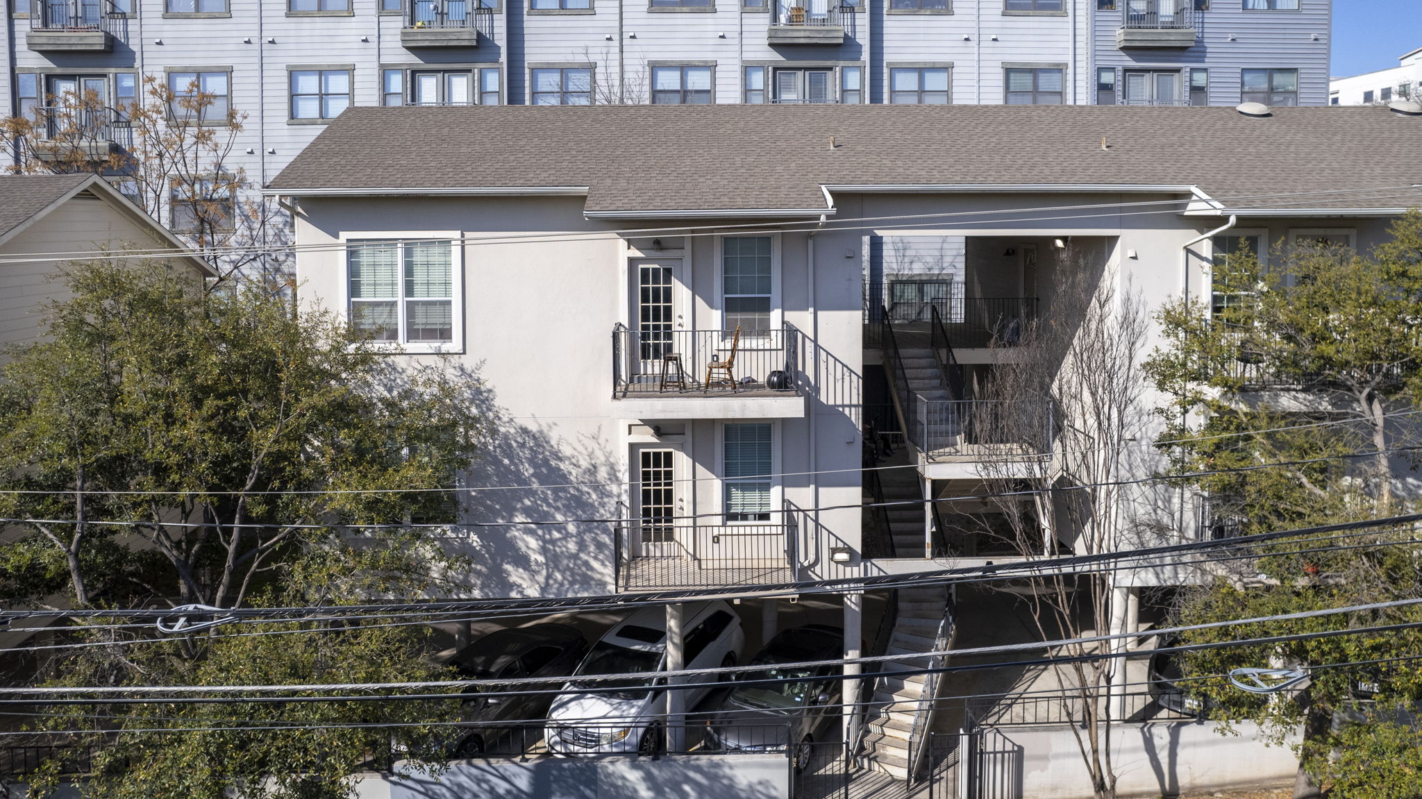 1100 West 25th Street, Unit 101 Austin, TX 78705 - Photo 2 of 39 a front view of a house with a yard