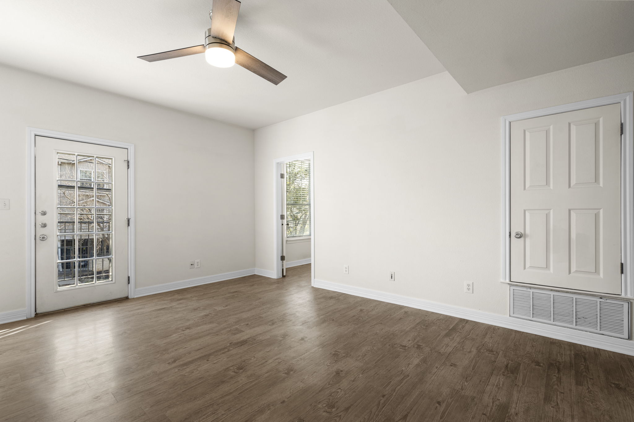 1100 West 25th Street, Unit 101 Austin, TX 78705 - Photo 27 of 39 wooden floor in an empty room with a window