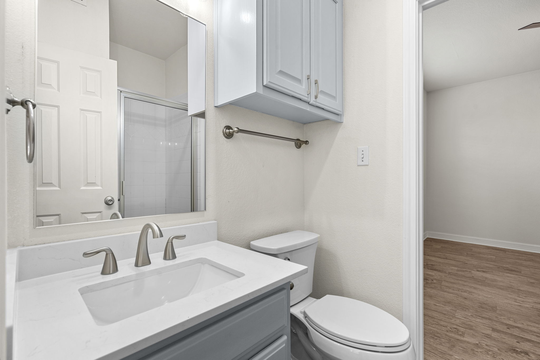 1100 West 25th Street, Unit 101 Austin, TX 78705 - Photo 31 of 39 a bathroom with a sink toilet vanity and shower