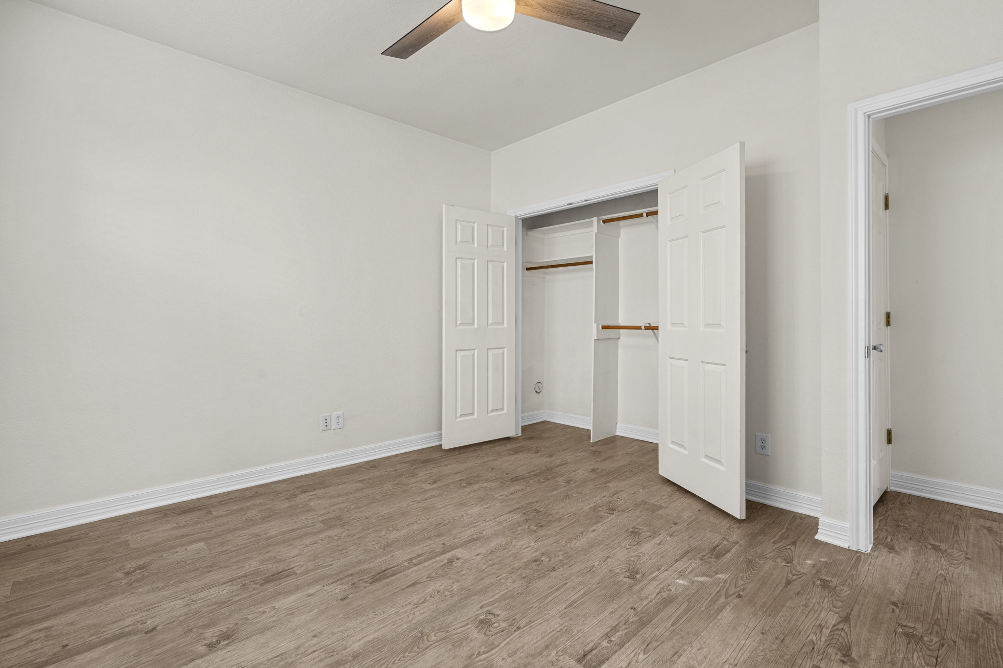 1100 West 25th Street, Unit 101 Austin, TX 78705 - Photo 34 of 39 wooden floor in an empty room