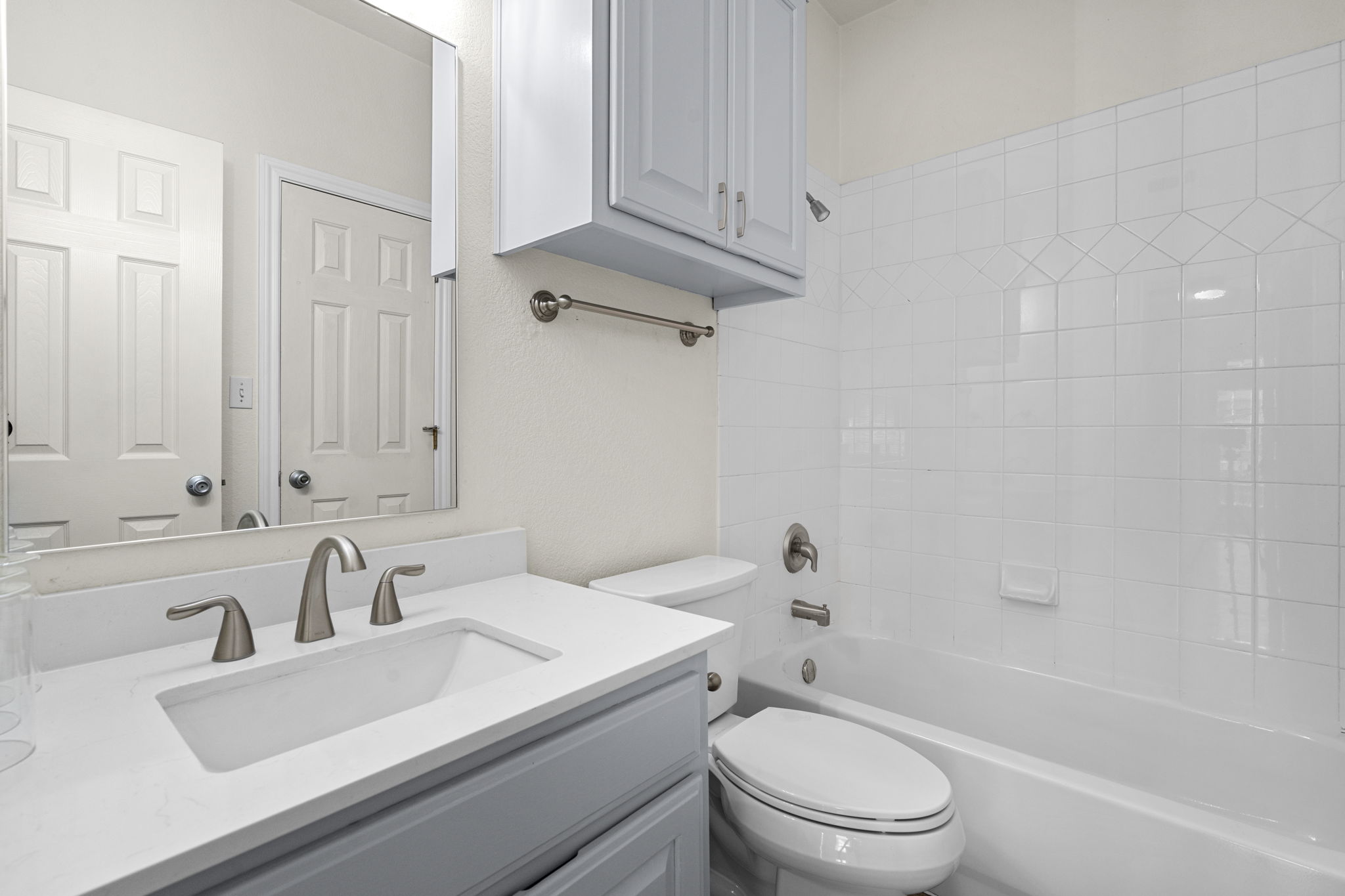 1100 West 25th Street, Unit 101 Austin, TX 78705 - Photo 38 of 39 a bathroom with a sink a toilet and shower