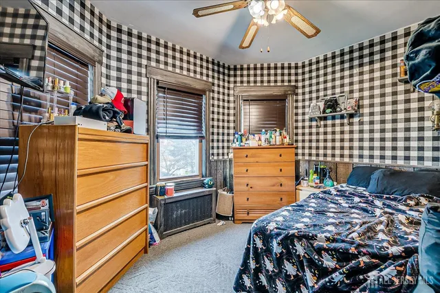 a bedroom with a bed and cabinets