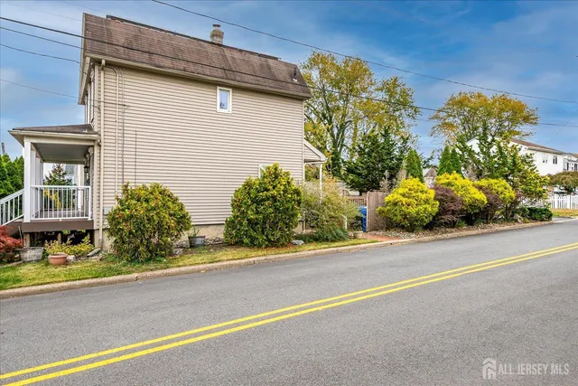 a front view of a house with a yard and a garage