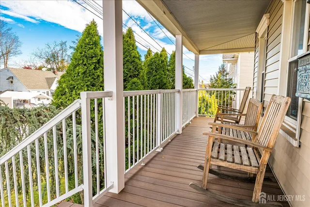 a view of balcony with wooden floor