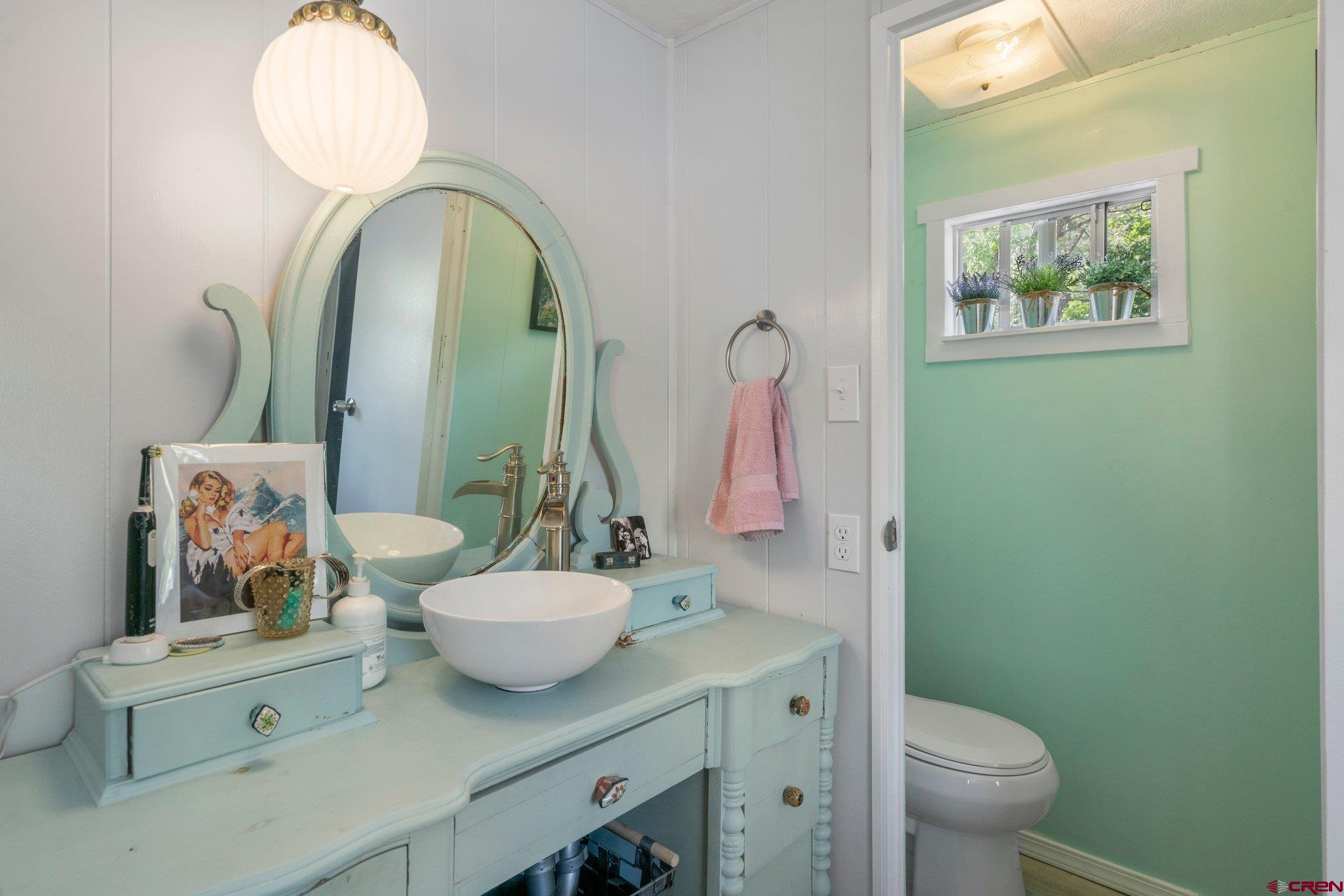485 Florida Road, Unit D6 Durango, CO 81301 - Photo 15 of 35 a bathroom with a toilet sink and mirror