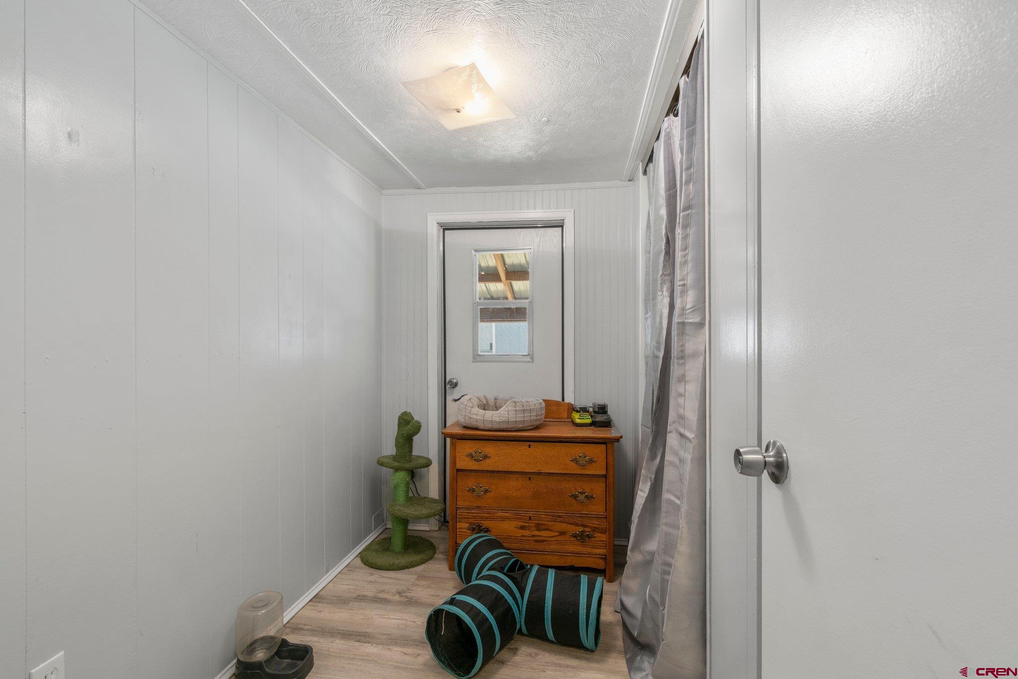 485 Florida Road, Unit D6 Durango, CO 81301 - Photo 17 of 35 a view of a hallway with wooden floor and cabinet