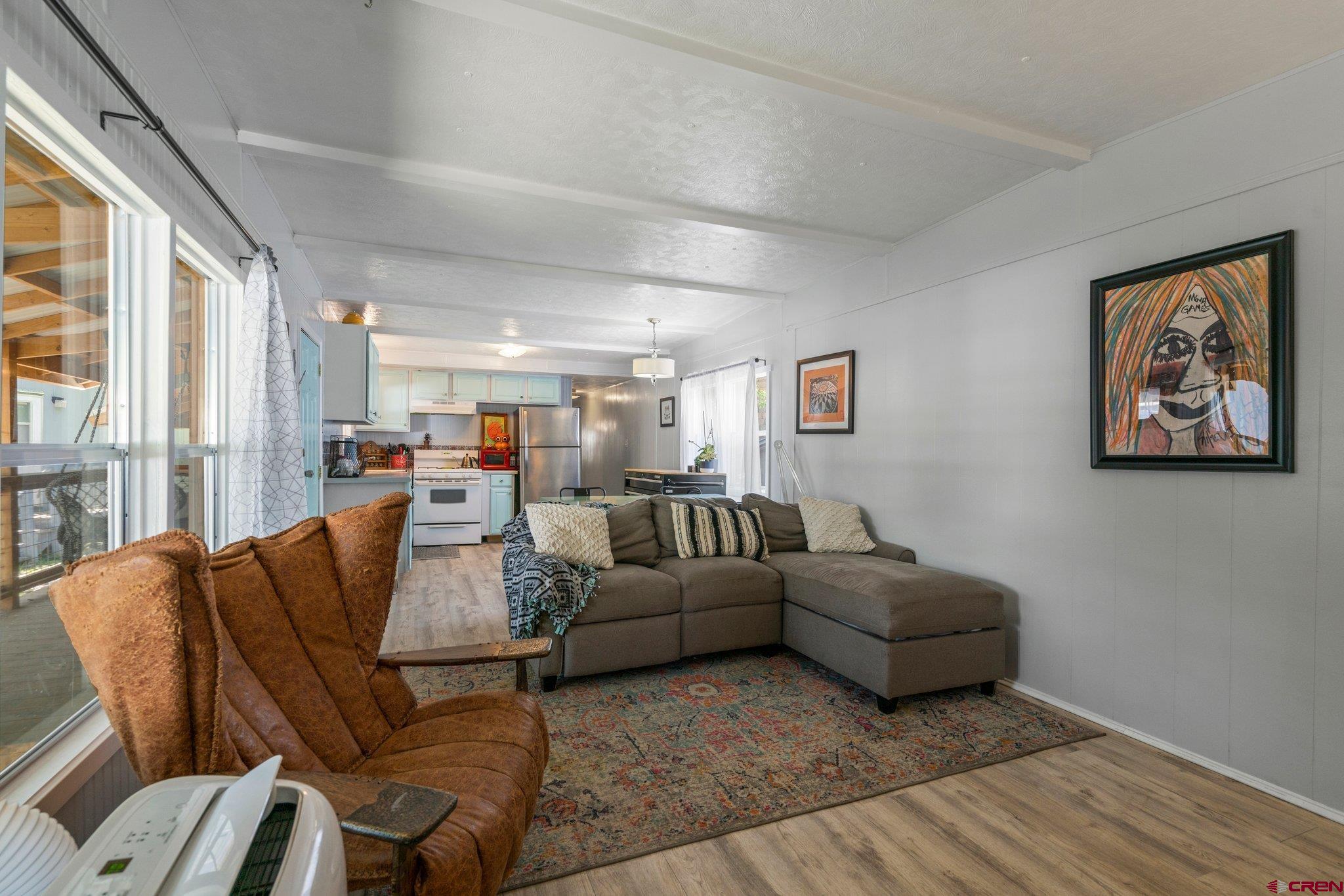 485 Florida Road, Unit D6 Durango, CO 81301 - Photo 2 of 35 a living room with furniture and a large window