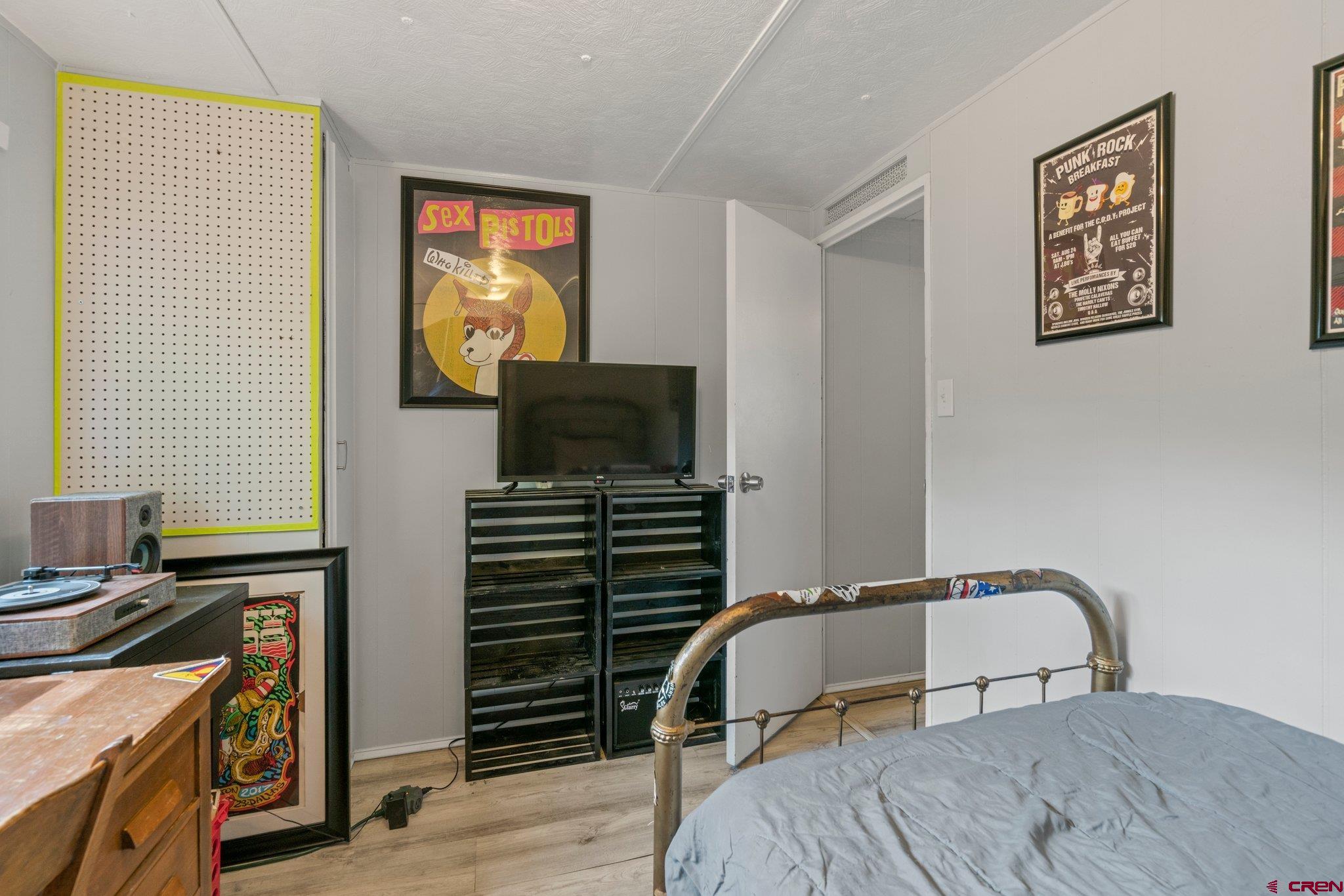 485 Florida Road, Unit D6 Durango, CO 81301 - Photo 21 of 35 a bedroom with a bed and a flat screen tv