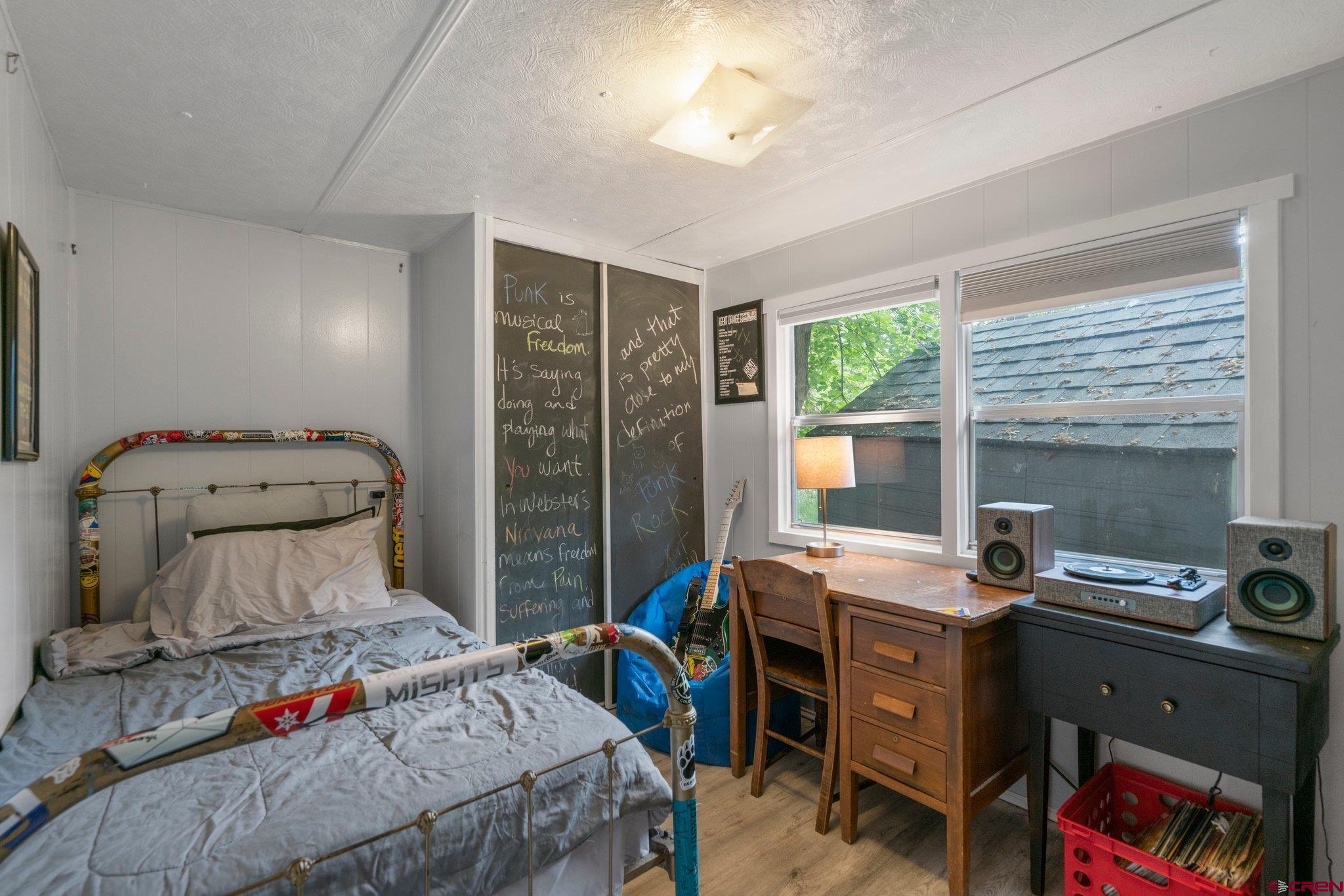 485 Florida Road, Unit D6 Durango, CO 81301 - Photo 22 of 35 a bedroom with a bed and a window