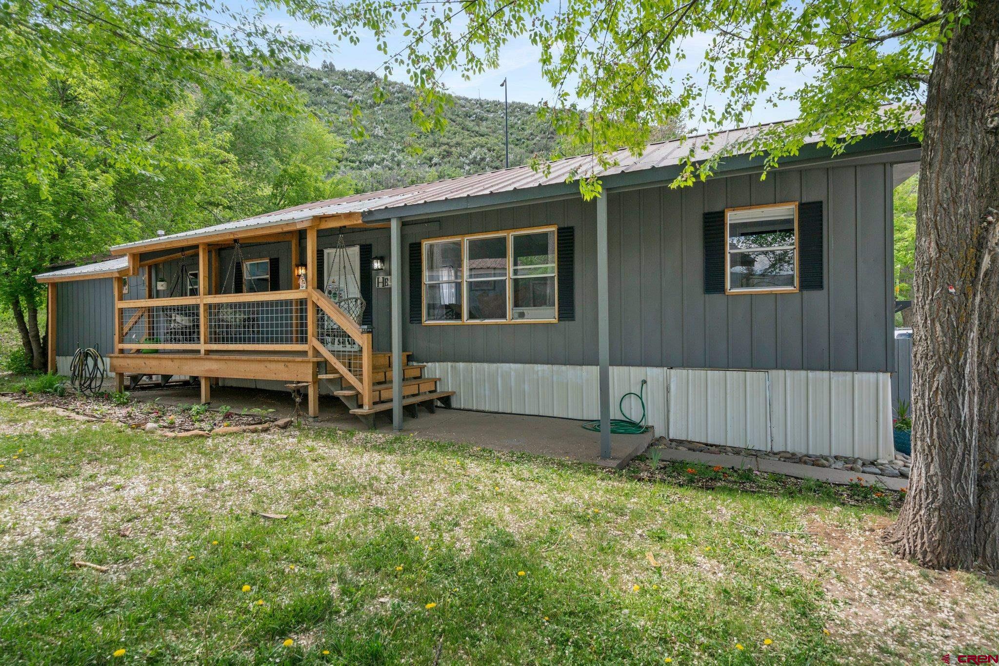 485 Florida Road, Unit D6 Durango, CO 81301 - Photo 24 of 35 a view of a house with a yard and wooden fence