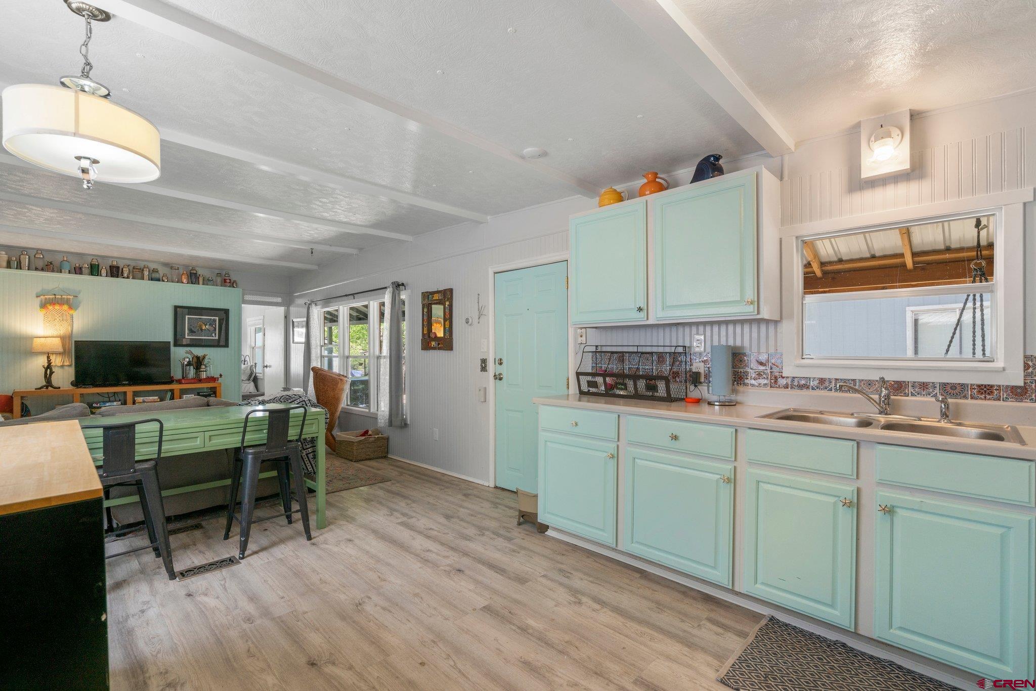 485 Florida Road, Unit D6 Durango, CO 81301 - Photo 4 of 35 a kitchen with a sink cabinets and window