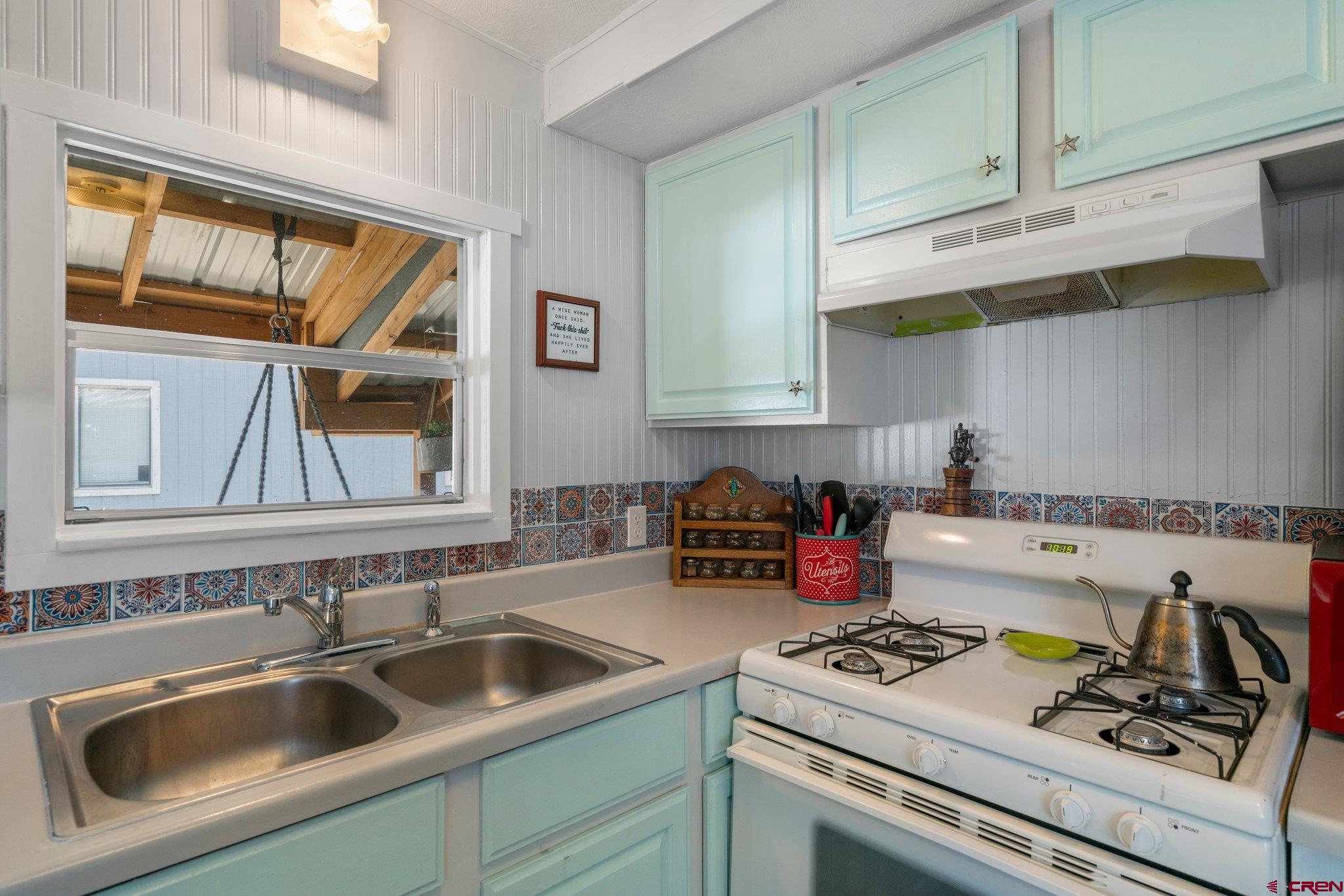 485 Florida Road, Unit D6 Durango, CO 81301 - Photo 7 of 35 a kitchen with a stove and a sink