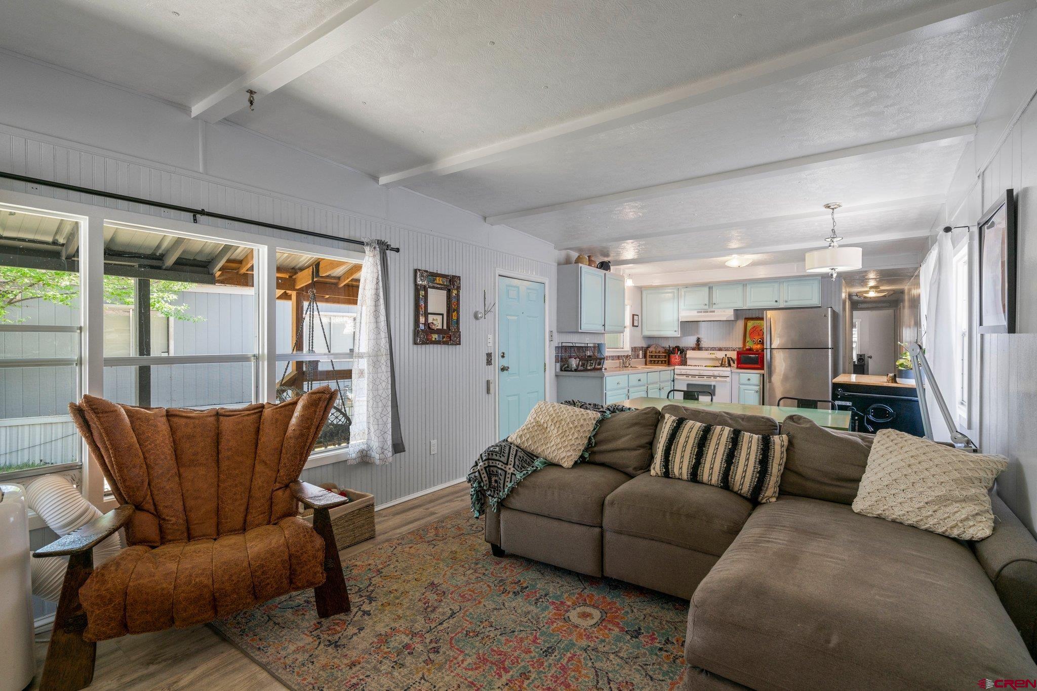 485 Florida Road, Unit D6 Durango, CO 81301 - Photo 9 of 35 a living room with furniture and a large window