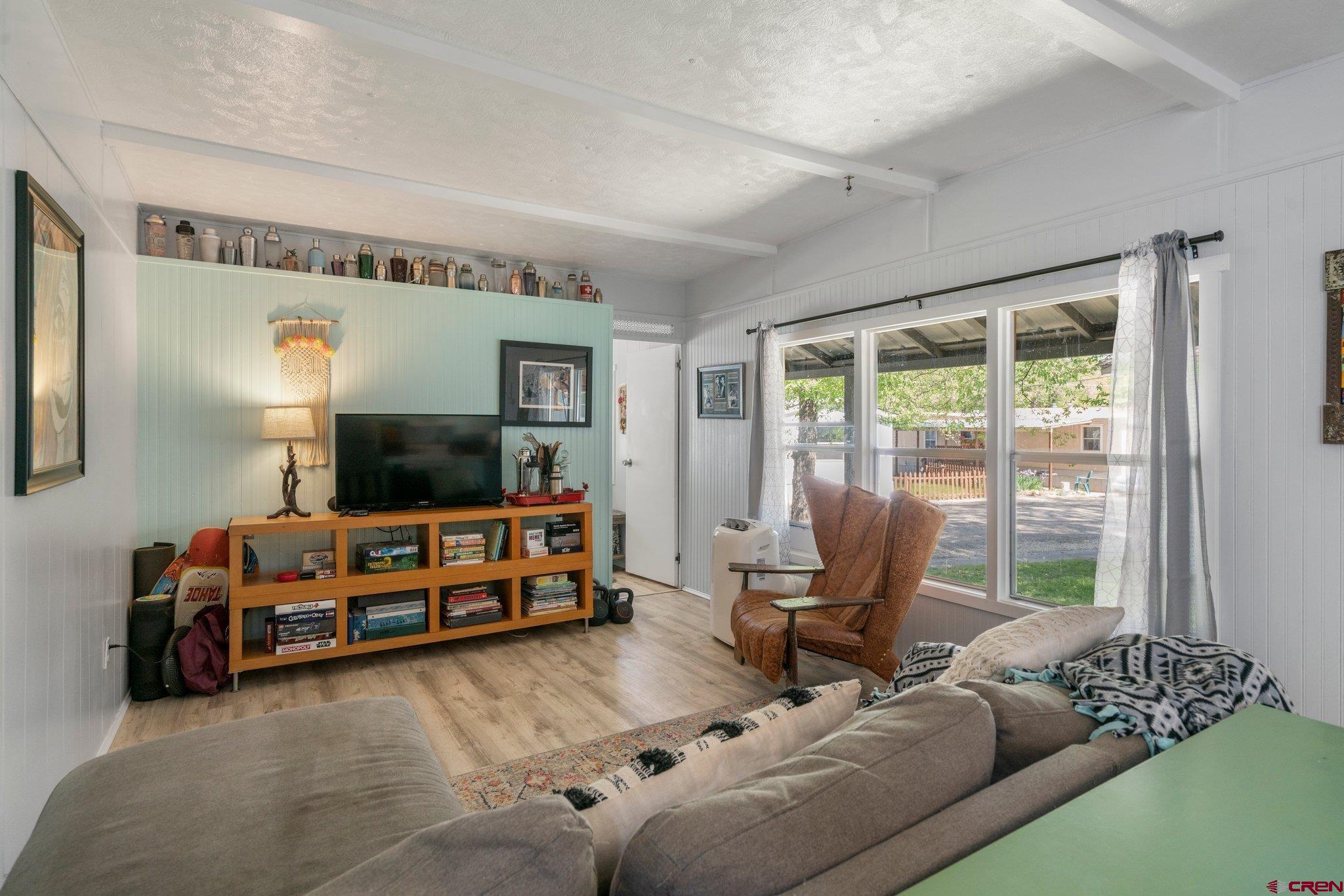 485 Florida Road, Unit D6 Durango, CO 81301 - Photo 10 of 35 a living room with furniture and a flat screen tv