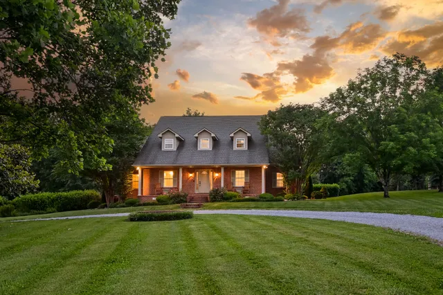 an aerial view of a house with a garden