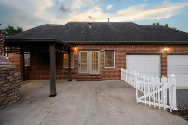 an empty room with closet and a ceiling fan