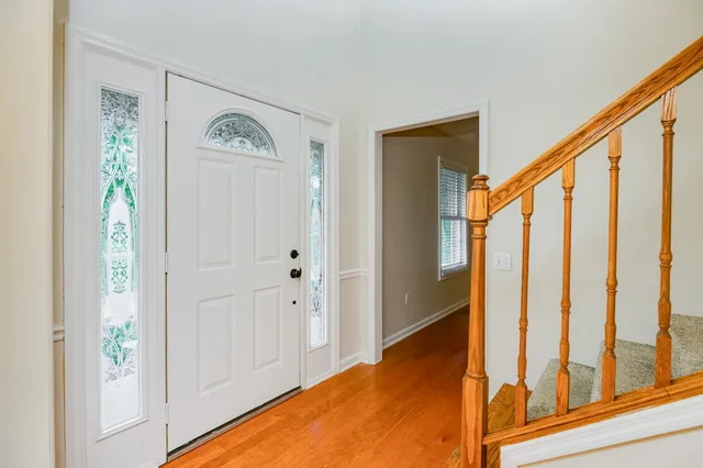 an empty room that has a window and a closet
