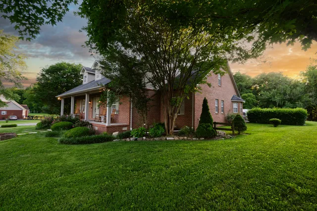 a room with kitchen island a sink and a refrigerator