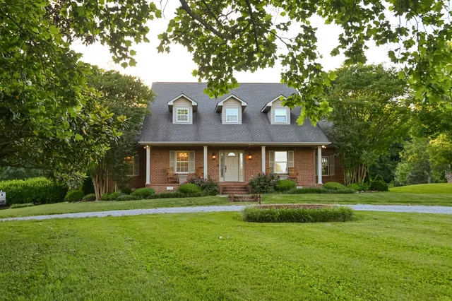 a kitchen with a sink a stove and cabinets