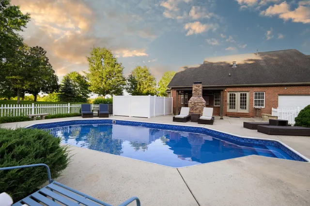a view of a house with swimming pool