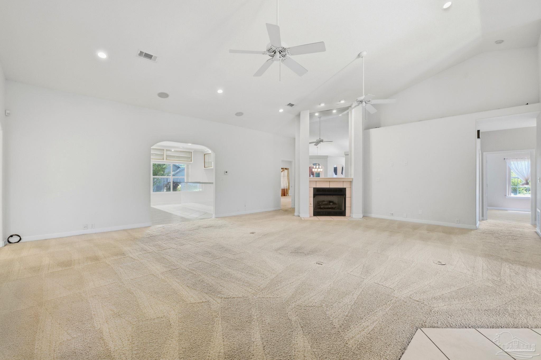 4552 Peaden Road Pace, FL 32571 - Photo 11 of 38 a view of an empty room with a fireplace