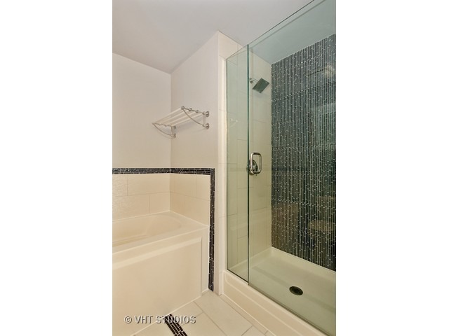 1530 South State Street, Unit 612 Chicago, IL 60605 - Photo 13 of 25 a bathroom with a shower and a sink