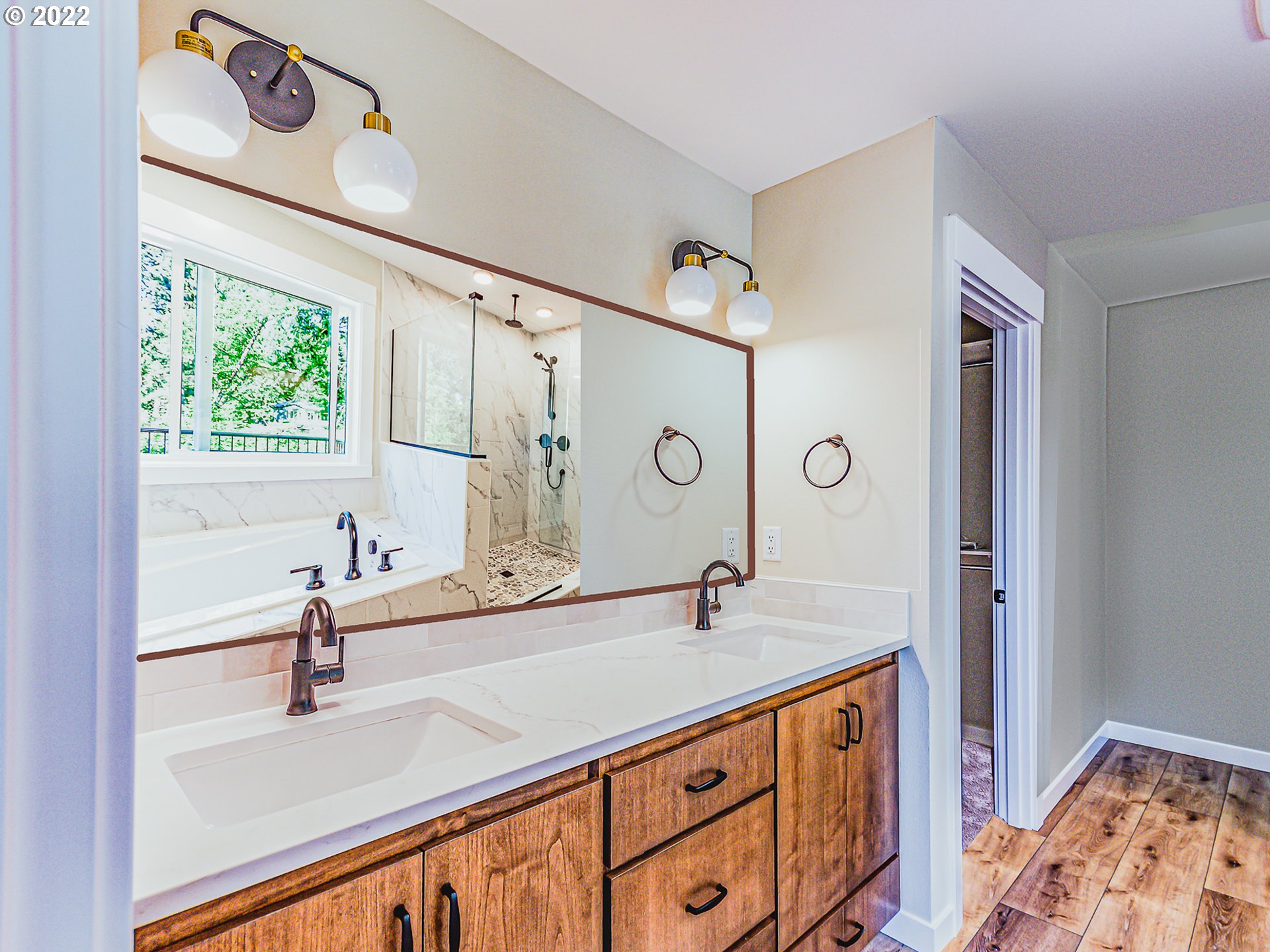 2217 South Royal Court Ridgefield, WA 98642 - Photo 11 of 26 a bathroom with a sink and a mirror