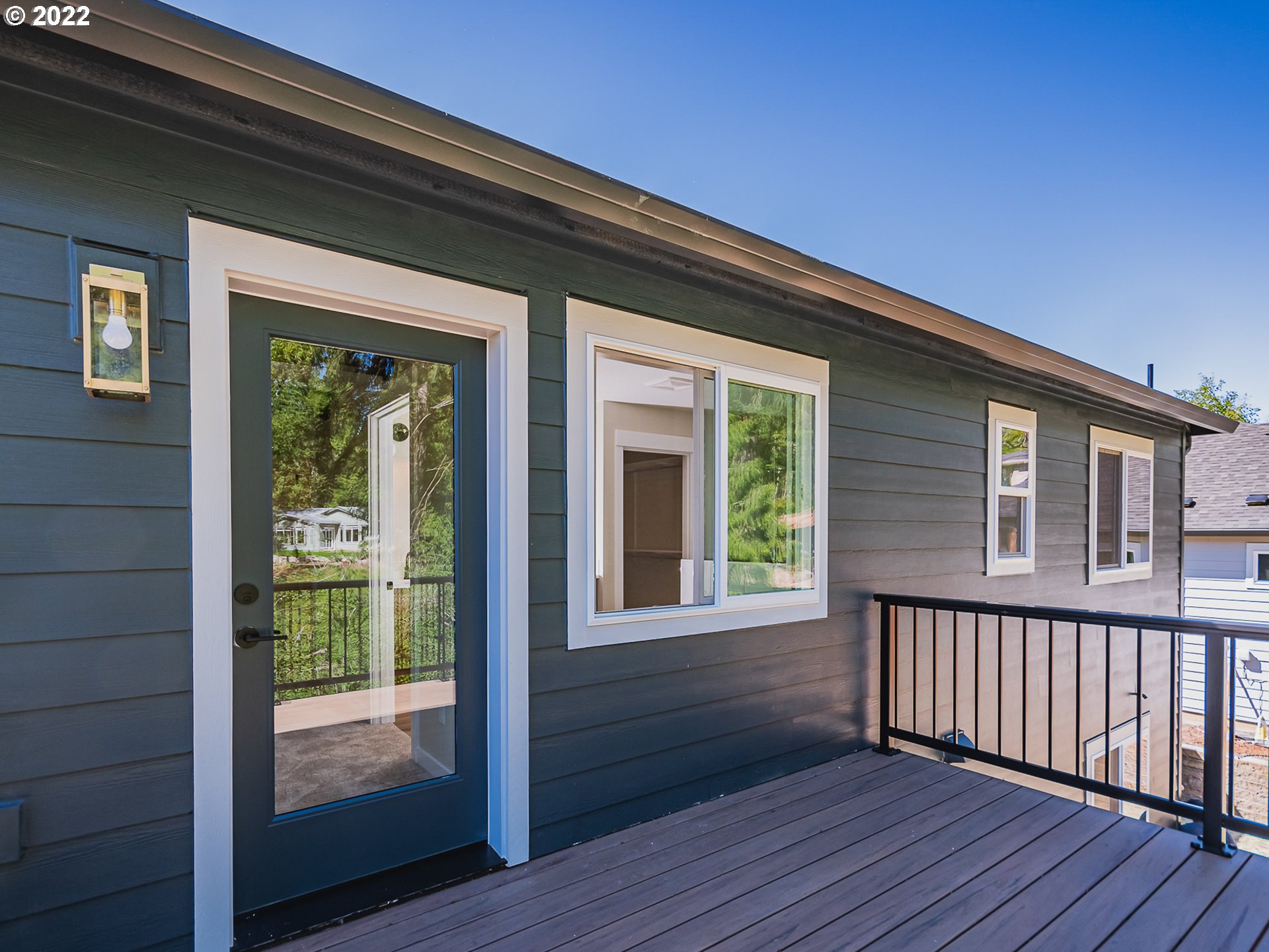 2217 South Royal Court Ridgefield, WA 98642 - Photo 23 of 26 a view of deck with a floor to ceiling window and wooden floor