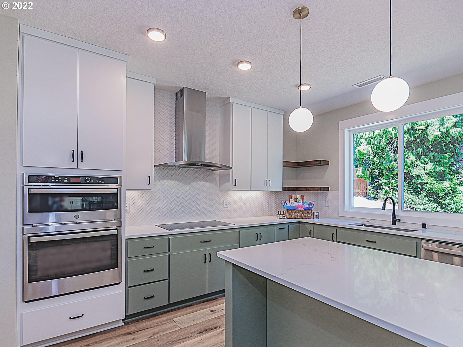 2217 South Royal Court Ridgefield, WA 98642 - Photo 4 of 26 a kitchen that has a lot of cabinets in it
