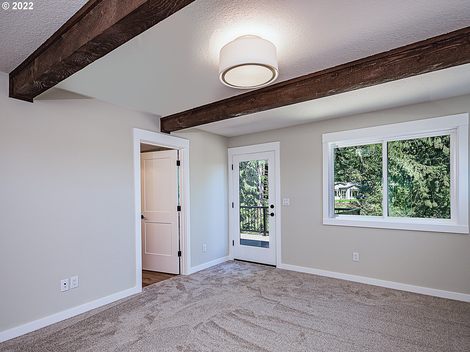 2217 South Royal Court Ridgefield, WA 98642 - Photo 10 of 26 a view of an empty room with wooden floor and windows