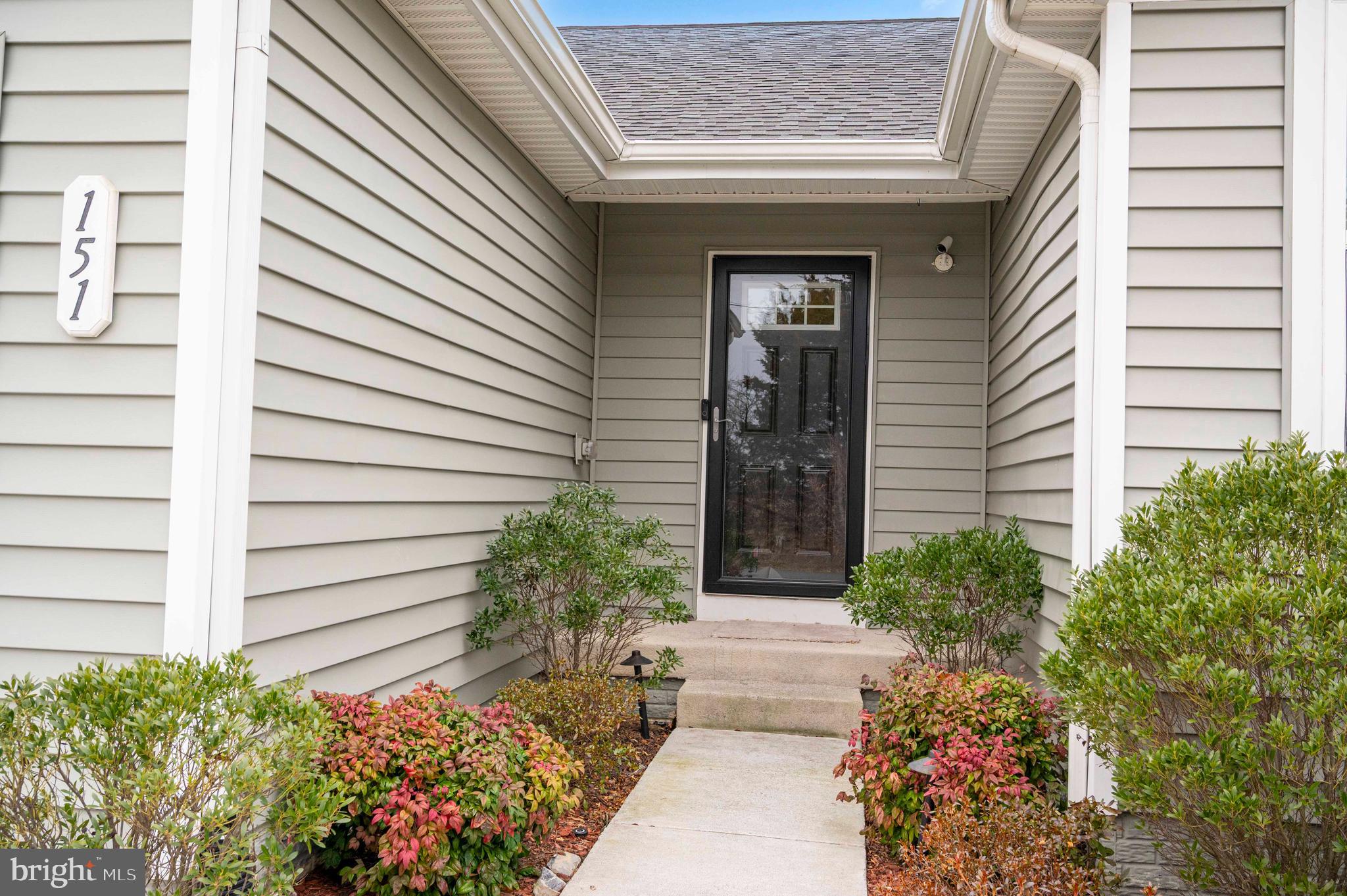 151 Cougill Road Middletown, VA 22645 - Photo 14 of 41 a front view of a house with a flower garden