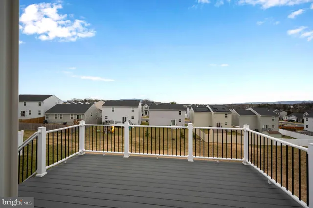 a view of a balcony with furniture
