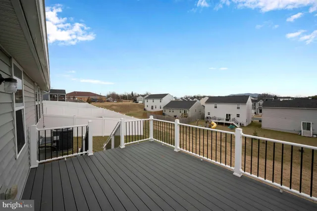 a view of a balcony with furniture