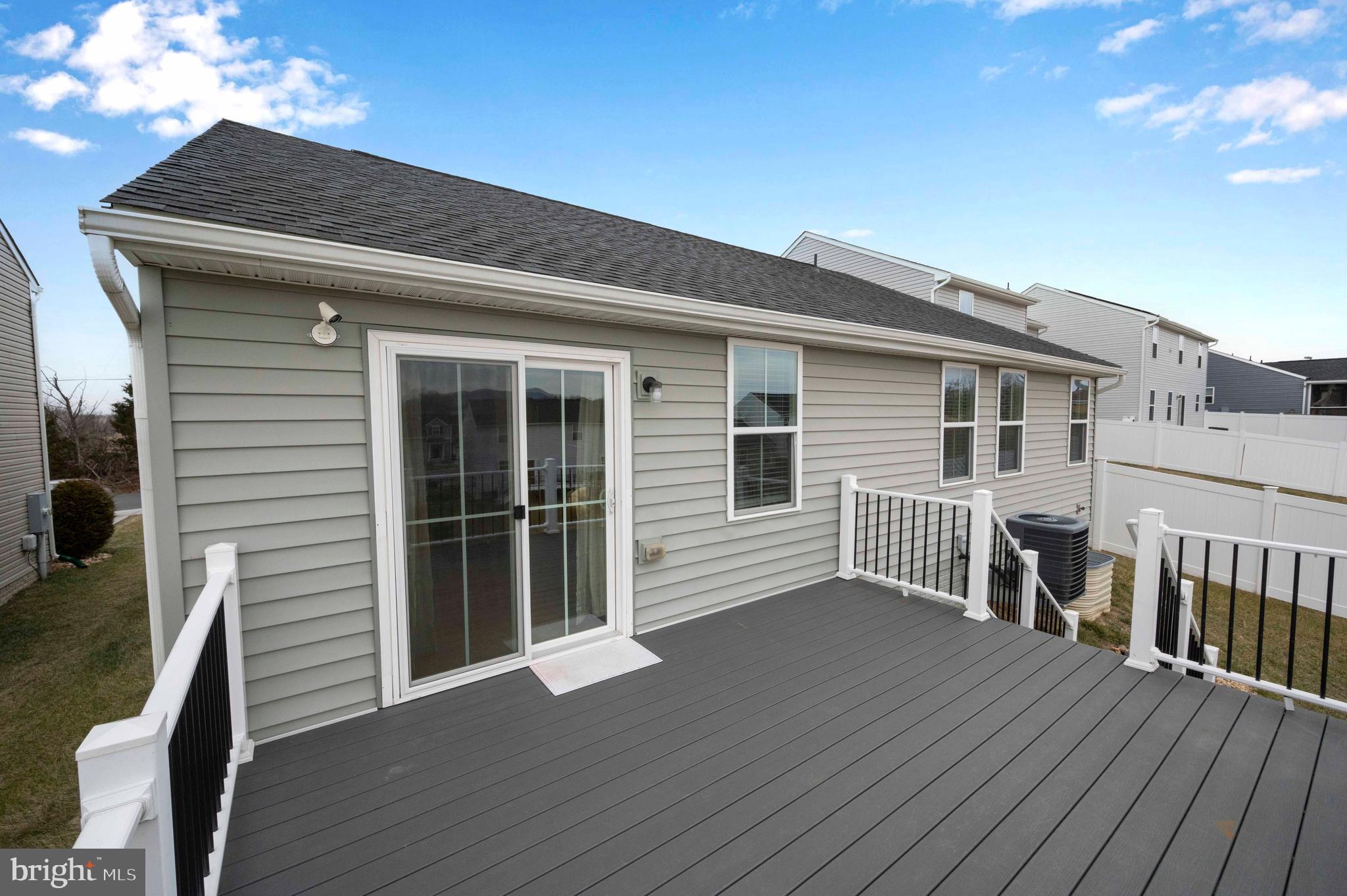 151 Cougill Road Middletown, VA 22645 - Photo 28 of 41 a view of a house with a deck and a barbeque grill with wooden floor and fence