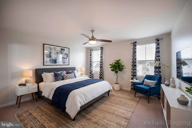 a bathroom with a toilet a sink a mirror and vanity