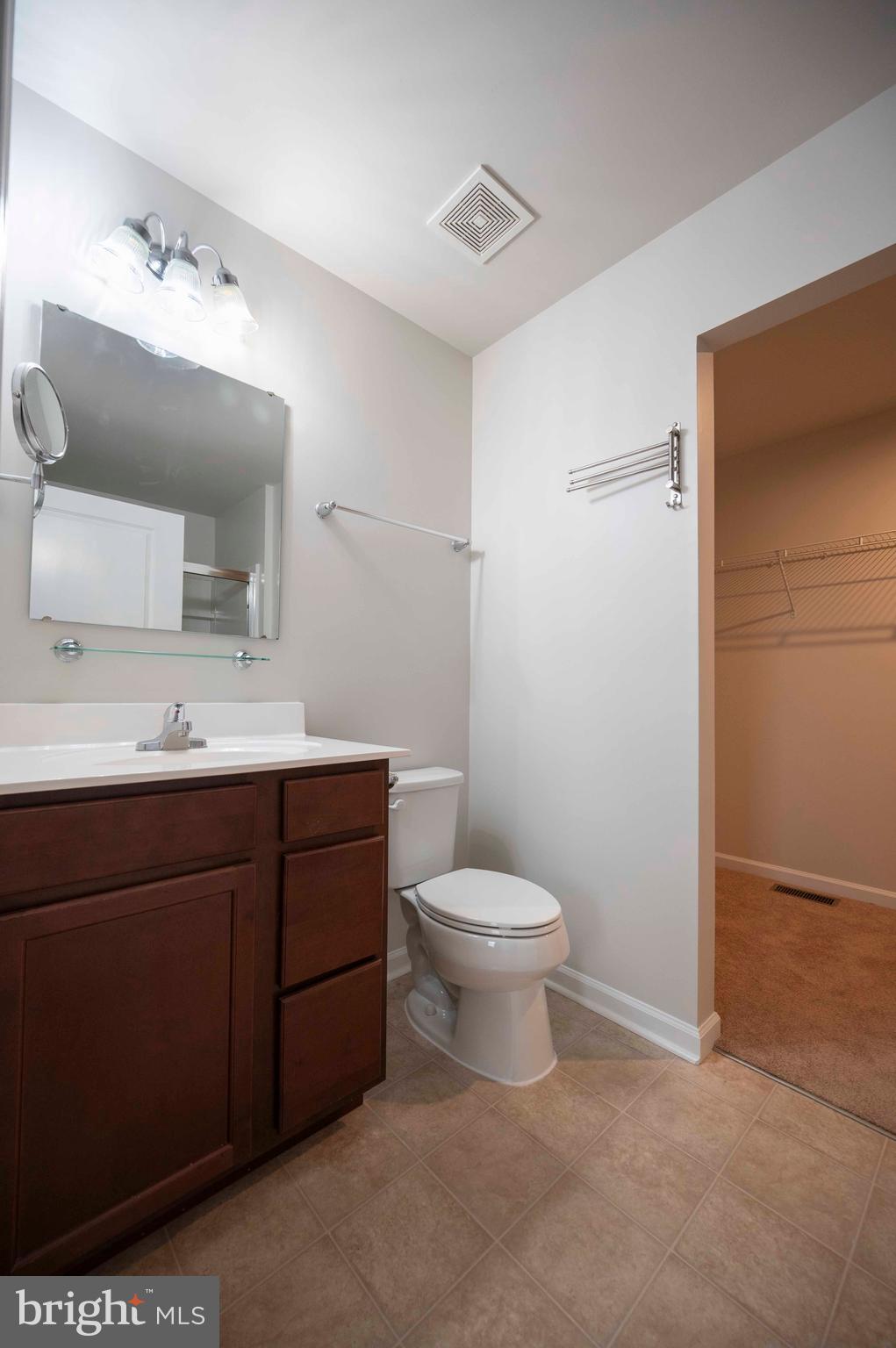 151 Cougill Road Middletown, VA 22645 - Photo 34 of 41 a bathroom with a toilet a sink a mirror and vanity
