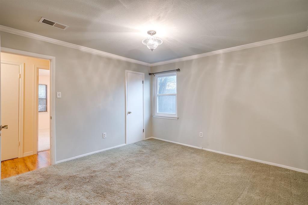 856 Broadway Avenue Euless, TX 76040 - Photo 20 of 35 an empty room with windows and fan