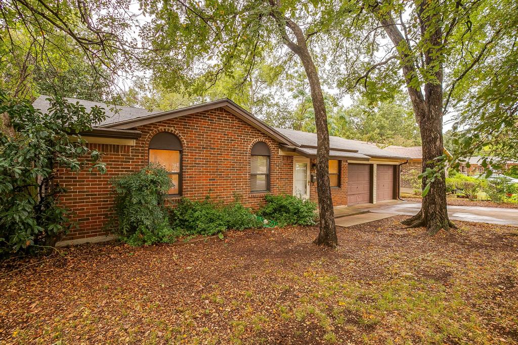 856 Broadway Avenue Euless, TX 76040 - Photo 2 of 35 a view of a house with a yard and large tree