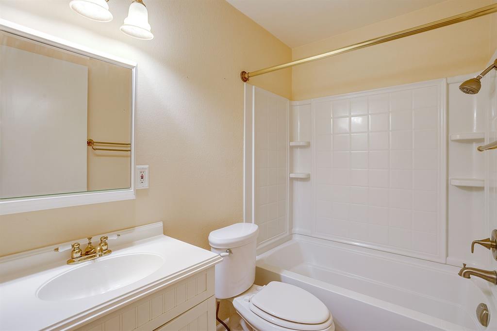 856 Broadway Avenue Euless, TX 76040 - Photo 25 of 35 a bathroom with a sink toilet and shower