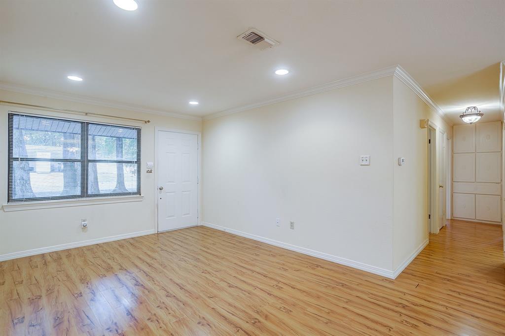 856 Broadway Avenue Euless, TX 76040 - Photo 6 of 35 a view of empty room with wooden floor and fan