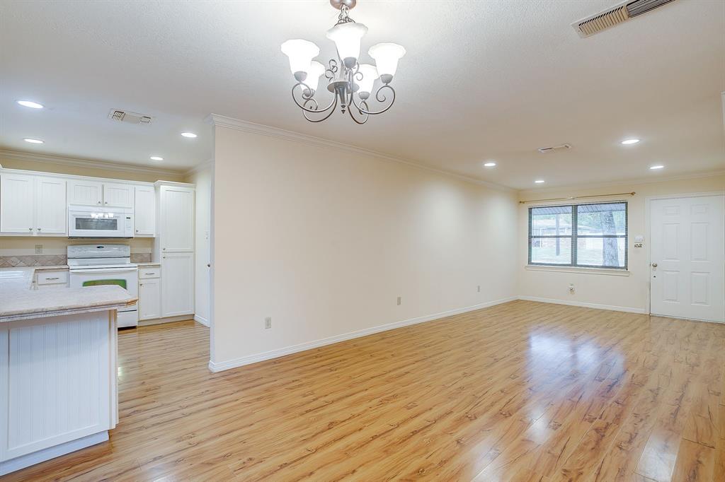 856 Broadway Avenue Euless, TX 76040 - Photo 9 of 35 a view of kitchen with sink and wooden floor