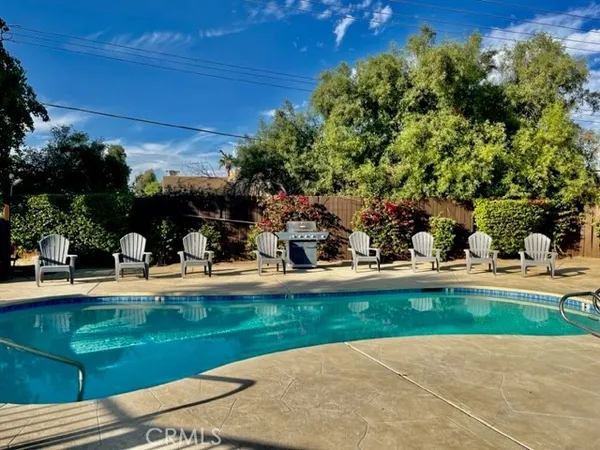 a view of a swimming pool with a patio