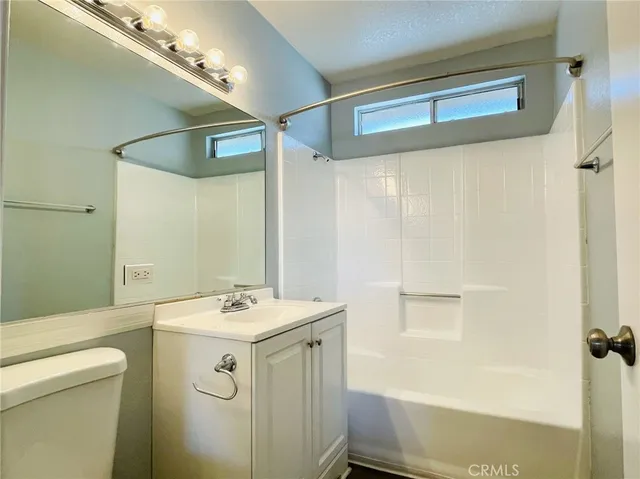 a bathroom with a sink a mirror and a shower