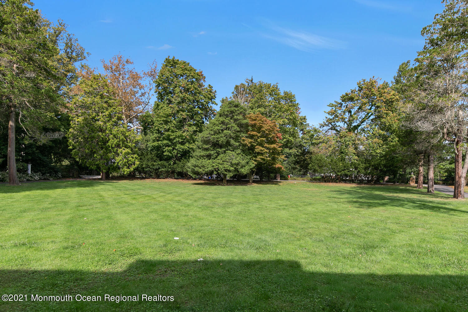 83 Rumson Road Rumson, NJ 07760 - Photo 2 of 56 a view of a field of grass and trees