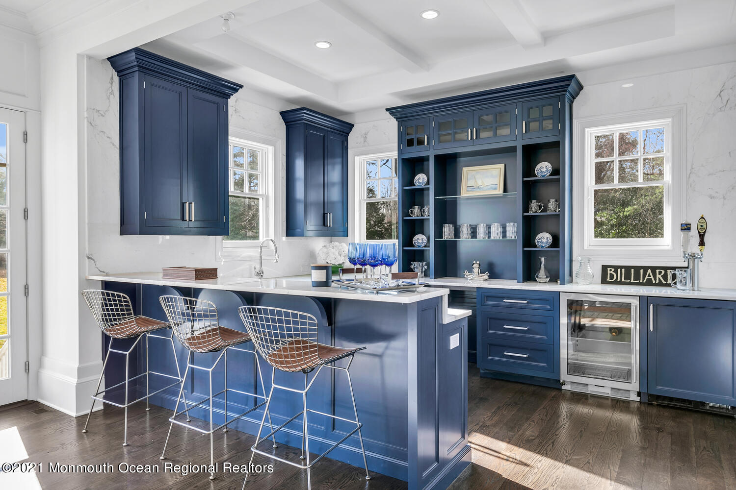 83 Rumson Road Rumson, NJ 07760 - Photo 16 of 56 a kitchen with a dining table chairs cabinets and stainless steel appliances
